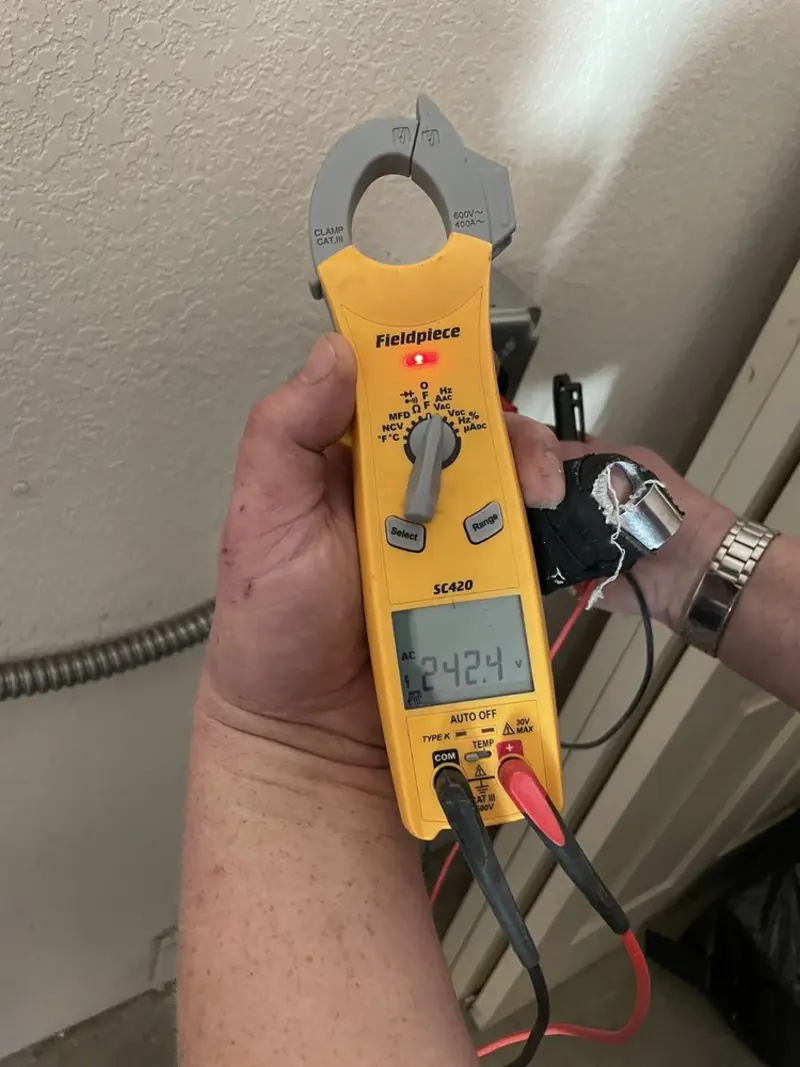 Voltage testing with clamp meter during Hot Tub / Pool Electrical Wiring in Milton